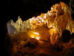 Inside view of a cave in Ha Long Bay with rocky formations and natural sunlight