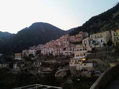 Panoramic view of the coastal village Albori with colorful houses and lush greenery
