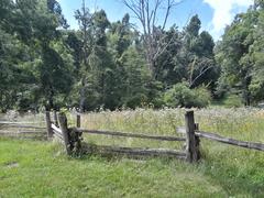 Wooden fence and fields along the trail at Humpback Rocks Visitor Center on Blue Ridge Parkway