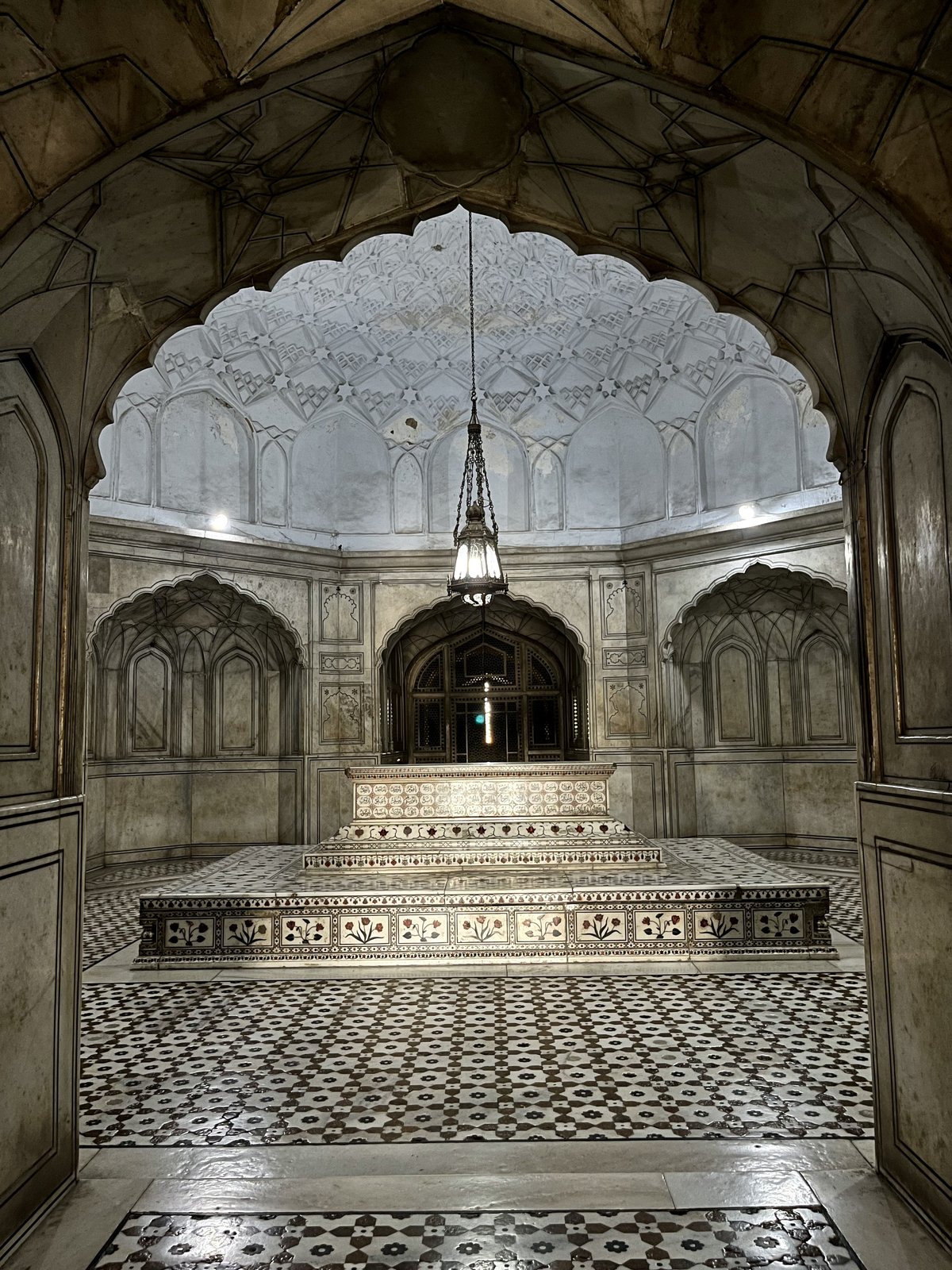 Intricately decorated interior of Tomb of Jahangir with detailed stone carvings and patterns