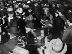Former president Marcelo Torcuato de Alvear trying to pass through a crowd to reach waiting car