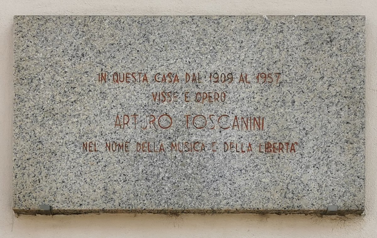 Commemorative plaque for Arturo Toscanini on the facade of 17th century Palazzo Toscanini in Milan