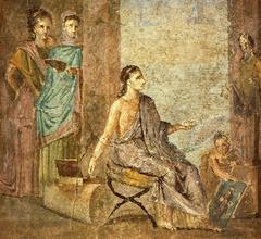 Woman painting a statue of Priapus in Pompeii's Casa del Chirurgo
