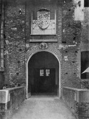 The main entrance gate of Castello di Novara showcasing historical stone architecture
