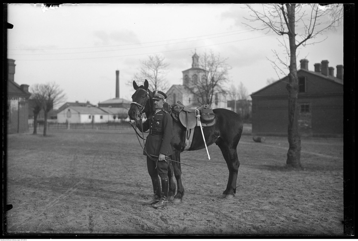 Por. Jan Kazimierz Motz with horse near garrison church of 1st Regiment of Lancers