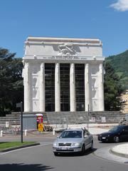Siegesdenkmal monument in Bolzano, Italy under a blue sky
