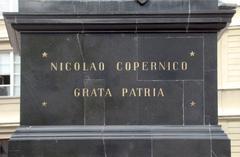 Latin inscription on a stone plaque by Nicolao Copernico