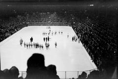 Crowd and hockey players inside Montreal Forum during Howie Morenz Benefit Game