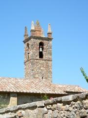 Historic bell tower made of brick and stone with architectural details