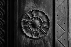 Close-up details of a bronze door with intricate patterns at Los Angeles City Hall