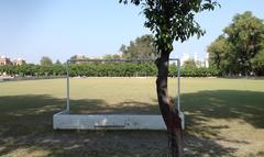 Islamia College hockey ground with surrounding buildings and greenery