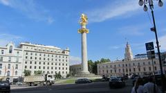 Freedom Square and monument in Tbilisi at sunset with bright sky