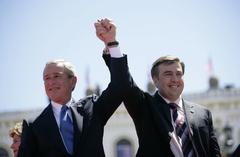 U.S. President George W. Bush and Georgian President Mikhail Saakashvili in Freedom Square, Tbilisi, May 10, 2005, greeting cheering crowds