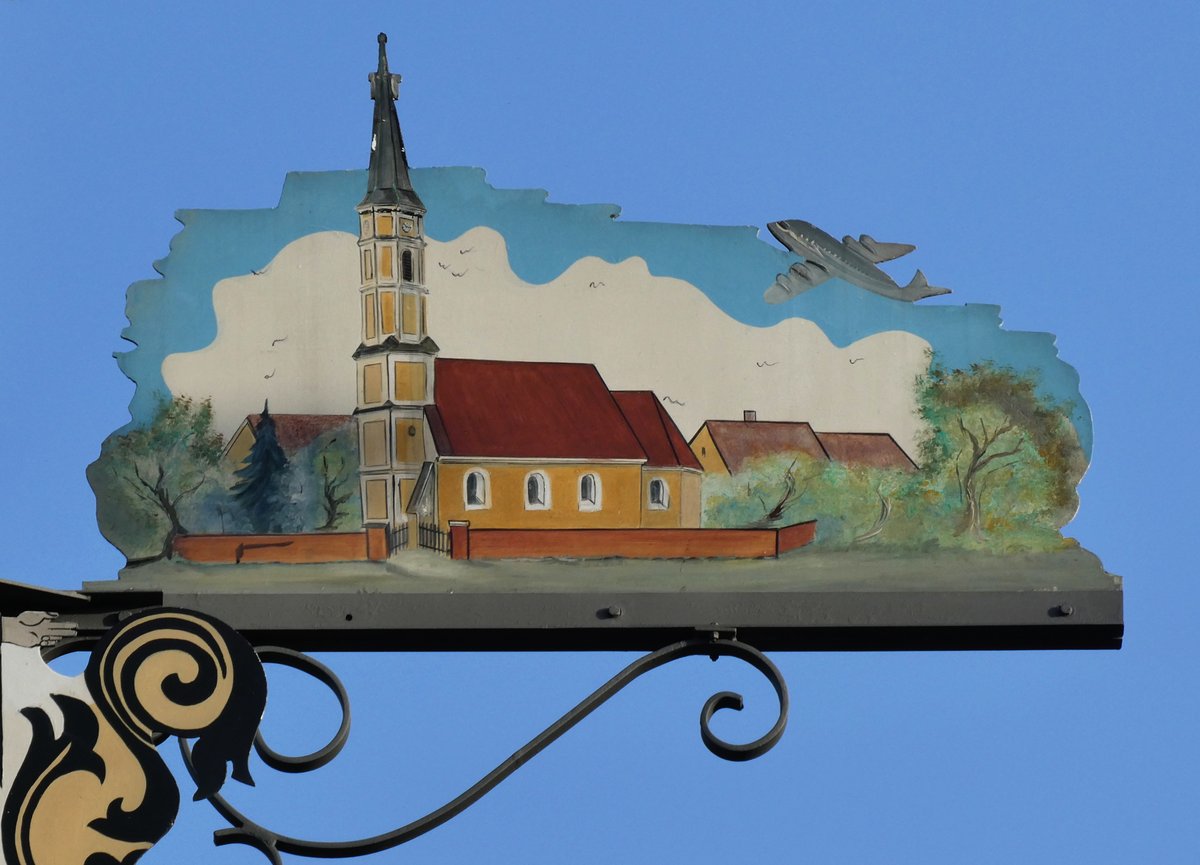 Florianskirche church and Maibaum in Trudering Munich with airplane symbol
