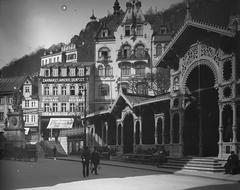 Historic Piac Kolonád with classical architecture and street lamps