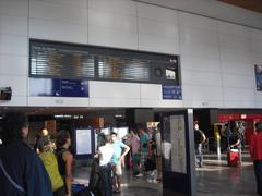 Eastern concourse of Toulouse Matabiau train station with people and seating area