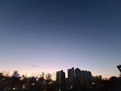 Sogang University campus buildings under a blue sky