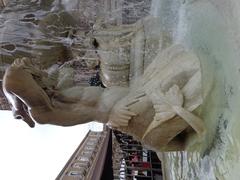 Close-up view of the right Triton sculpture at Fontana dell'Amenano in Catania