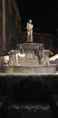 Fontana dell'Amenano illuminated at night in Catania