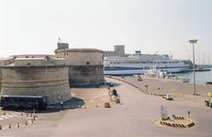 Aerial view of Civitavecchia harbor with ancient fort and docked ships