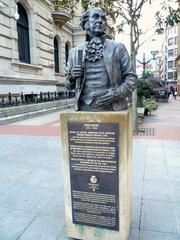 Monument to John Adams in Bilbao under clear blue sky