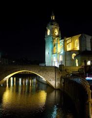 Iglesia de San Antón in Bilbao, Spain with stone architecture and arched windows