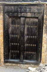 Traditional Omani wooden doors with intricate carvings and decorations