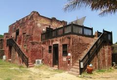 Traditional Omani house with wooden windows and white walls