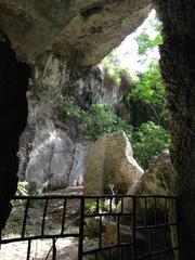 Latomie dei Cappuccini ancient stone quarries in Siracusa with rocky cliffs and green vegetation