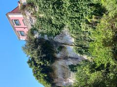 Carved stone quarries of Latomie dei Cappuccini in Siracusa with rocky cliffs and ancient walls
