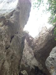 Latomie dei Cappuccini ancient stone quarries in Siracusa, Sicily with rugged rocky walls and open sky