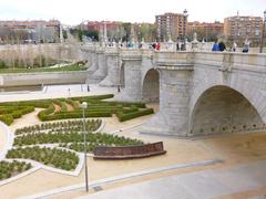 Puente de Toledo bridge in Madrid over the Manzanares River at sunset
