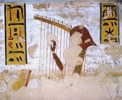 Harper playing musical instrument before deities Shu and Atum in ancient Egyptian tomb painting