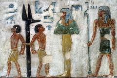 Enemies bound to jackal-headed pillar from Book of Gates scene in Ramses III tomb KV11