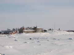 Liuskasaari island with Helsingfors Segelsällskap yacht club building in winter from Sirpalesaari island