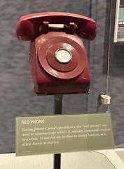 Red rotary telephone used by Jimmy Carter on display at the Jimmy Carter Library and Museum
