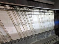 Relief sculptures on Muni Metro platform walls at Embarcadero station