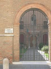 Exterior view of Museo della Resistenza Ferrara with clear blue sky