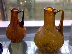 Two ancient Roman glass jugs amber with lattimo spots
