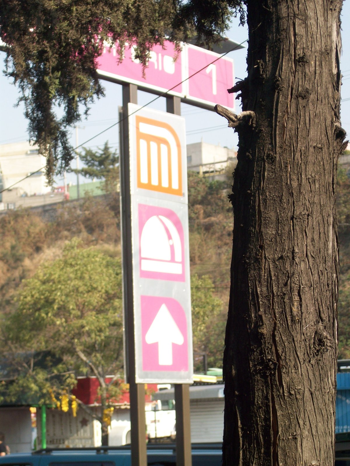 Metro Observatorio station sign with colorful metro logo