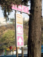 Metro Observatorio station sign with colorful metro logo
