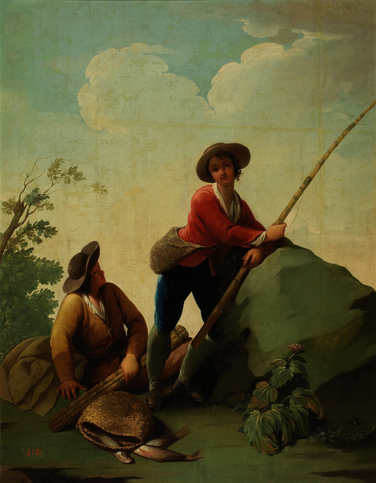 Two fishermen, one with a fishing rod and the other sitting