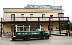 Vintage vehicles and buildings at Heritage Park Historical Village in Calgary