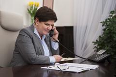 Polish Prime Minister Beata Szydło making a phone call