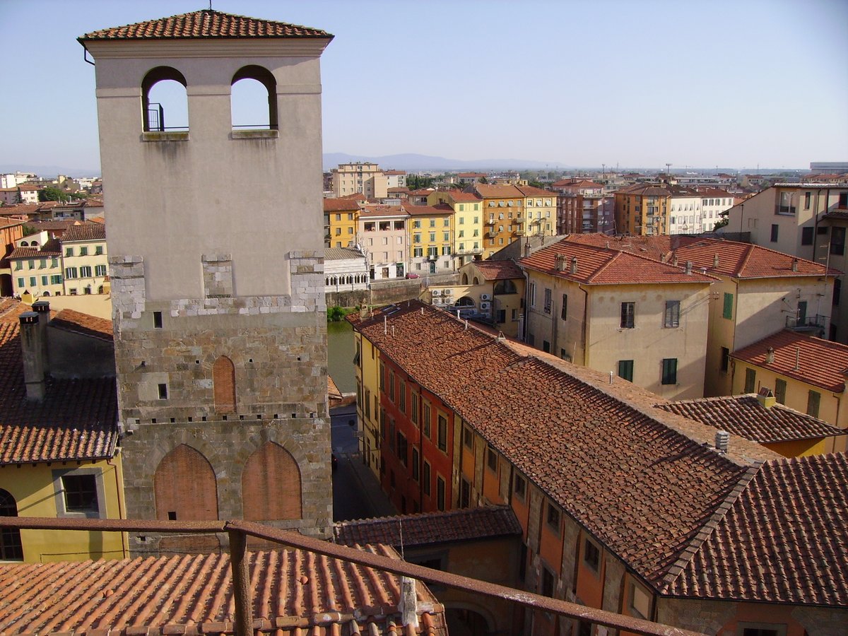 View of Torre de Cantone with the covered passage to the Palazzo delle Vedove on the right, Arno river in the center, and Church of La Spina detail