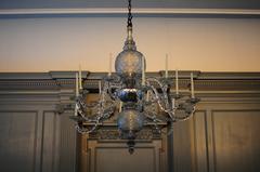 Glass chandelier with 12 arms holding white candles in Assembly Room of Independence Hall