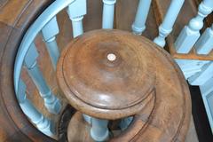 Ivory-buttoned walnut handrail volute on staircase inside Independence Hall used by Benjamin Franklin