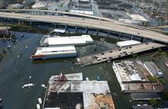 Flooded neighborhoods in New Orleans after Hurricane Katrina with rescue operation at flooded roadway intersection of Carrollton Avenue and Interstate 10