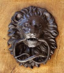 Close up of ornate door handles on a historic building in Florence