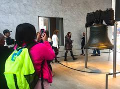 Visitor photographing the Liberty Bell at Independence National Historical Park in Pennsylvania